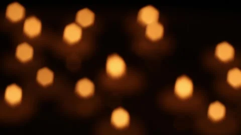 Warm abstract bokeh lights shifting softly in dark ambient scene Stock Footage 323581310