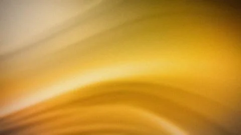 A warm abstract gradient featuring soft transitions of yellow and gold hues.. Stockillustratie