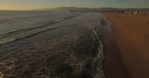 Warm Aerial drone footage from Venice Beach, Los Angeles at sunset Stock Footage