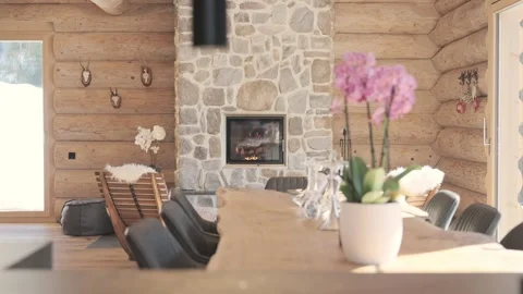 Warm and cozy interior of a mountain log cabin with a burning fireplace and Stock-Footage 335198924