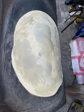 A warm and fluffy round flatbread, ideal for everyday meals. Stock Photos