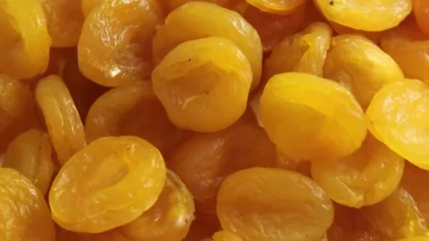 In a warm and inviting kitchen, dried apricots are skillfully prepared and Stock Footage 292757990