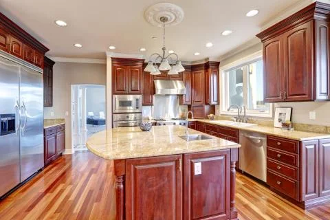 Warm and inviting kitchen with large kitchen island, Stock Photos