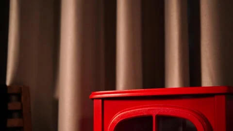 A warm and inviting winter scene with a retro red fireplace. Stock Footage 328409008