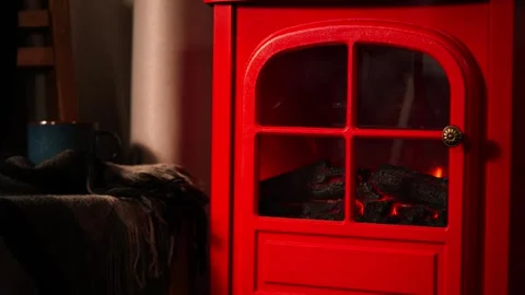 A warm and inviting winter scene with a retro red fireplace. Stock Footage 328409116