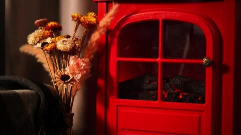 A warm and inviting winter scene with a retro red fireplace. Stock Footage 328409244