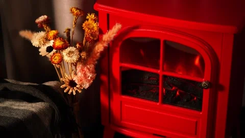 A warm and inviting winter scene with a retro red fireplace. Stock Footage 328409672