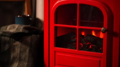 A warm and inviting winter scene with a retro red fireplace. Stock Footage 328410073
