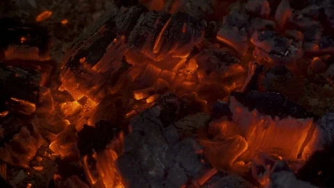 A warm and moody feel. The light seems to dance in the hot coal that glows Stock Footage 104643550