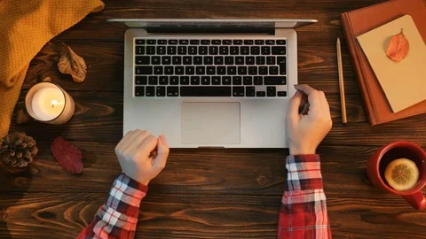 Warm autumn conception. Table top view of woman typing on the laptop computer Video stock 80803009