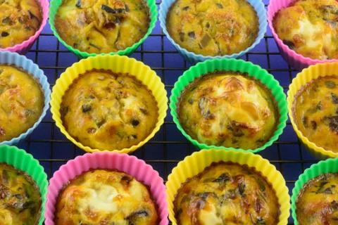 Warm baked scrambled egg cups Stock Photos
