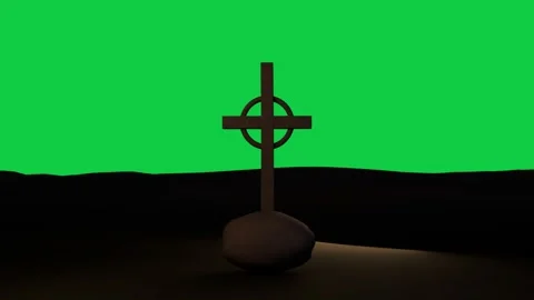 Warm beam starting right lighting Celtic cross on base, revealing form; Stock Footage 337887624