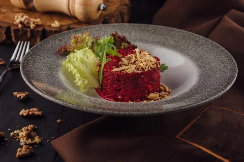 Warm beetroot, nuts and herbs salad Stock Photos