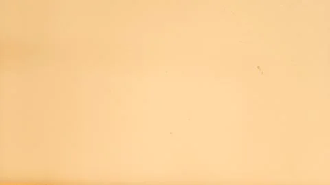 Warm beige wall texture with smooth surface and soft lighting, perfect for .. Stock Photos