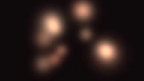 Warm Blurred Light Orbs on Dark Background Seamless Loop Stock Footage 340650506