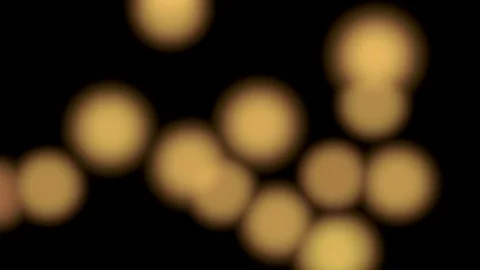 Warm bokeh background with flying blurred lights on black, seamless looping (4K) Stock-Footage 105613110