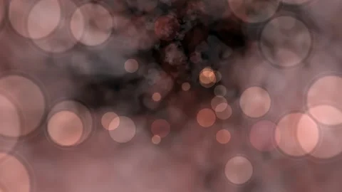 Warm bokeh lights float softly against dark, smoky backdrop Video stock 337227124