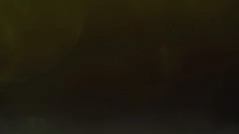 Warm bokeh moving in the dark studio. Creative background. Stock Footage 100128223