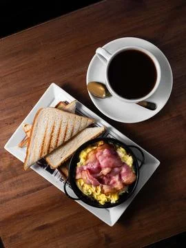 Warm breakfast spread on rustic wooden table Stock Photos
