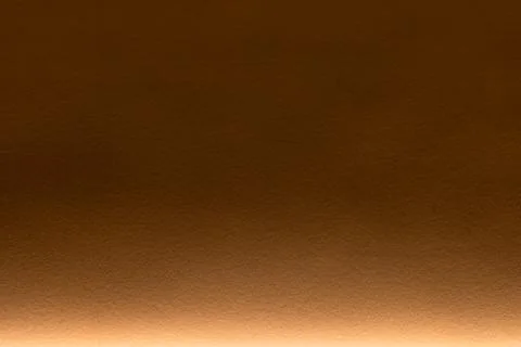 Warm brown gradient paper wall texture with bottom illumination Stock Photos