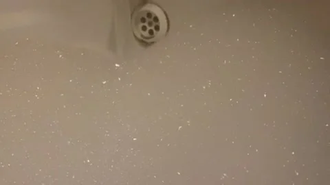 A warm bubble bath being filled up close 動画素材 148044391