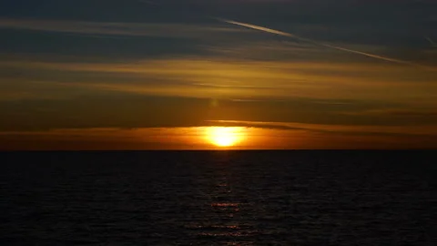 Warm calm sunset over the mediterranean sea, golden light over the water Stock Footage 108320628