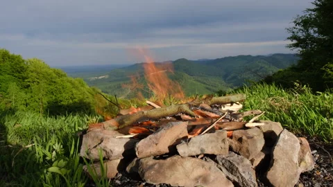 Warm campfire on top of mountain with beautiful nature Landscape Stock Footage 195861408