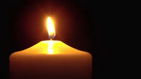 Warm candle on black Stock Footage 46980480