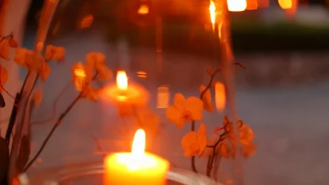 Warm candle light burning outside in the evening. pan Stock Footage 107279426
