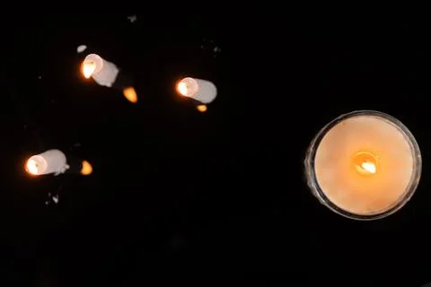 Warm Candlelight on Dark Background Stock Photos