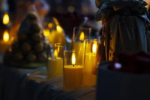 Warm candlelight illuminates a festive table setting Stock Photos