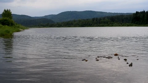 Warm clear waters flow after winter outdoors Stock Footage 91683245