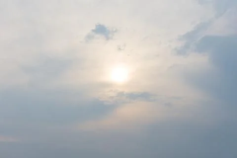 Warm cloudy sky nature background blurring, warm colors and bright sunlight. Stock Photos