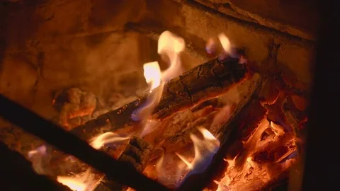 Warm cozy burning fire in a brick fireplace close up Stock Footage 73535801
