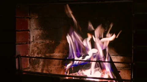 Warm cozy burning fire in a brick fireplace close up Stock Footage 73538732
