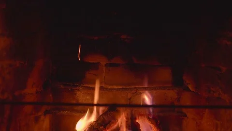 Warm cozy burning fire in a brick fireplace close up Stock Footage 74435411