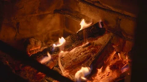 Warm cozy burning fire in a brick fireplace close up Stock Footage 74837692