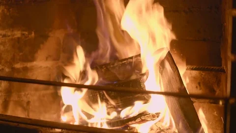 Warm cozy burning fire in a brick fireplace close up Stock Footage 75042425