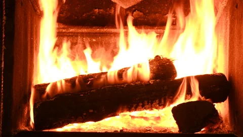 Warm cozy burning fire in a brick fireplace, close-up shot 4k Vídeo Stock 145933203