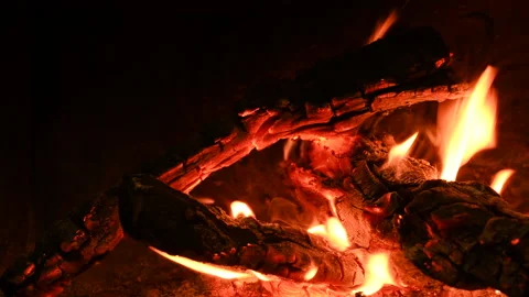 Warm cozy burning fire in a brick fireplace, close-up shot 4k Vídeo Stock 146009978