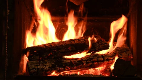 Warm cozy burning fire in a brick fireplace, close-up shot 4k Vídeo Stock 146010599