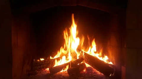 Warm cozy burning fire in a brick fireplace, close-up shot Stock Footage 161679890