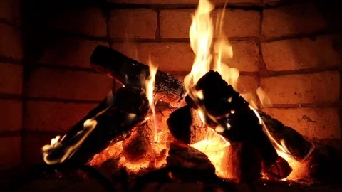 Warm cozy fire in a brick fireplace closeup Stock Footage 83970017