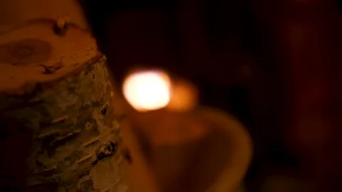 Warm cozy fire in the fireplace. Logs against a background of crackling fire. Stock Footage 148374867