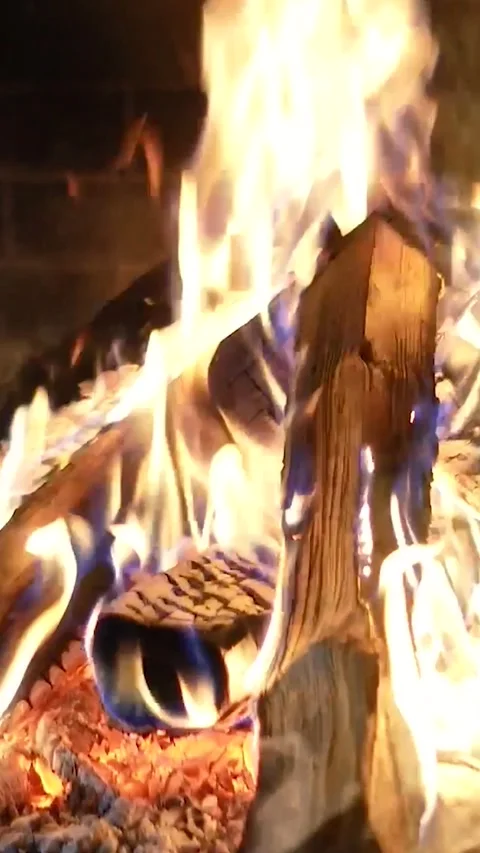Warm cozy fireplace Heating fire with firewood in chalet. Flames close-up Stock Footage 301615770