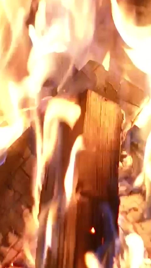 Warm cozy fireplace Heating fire with firewood in chalet. Flames close-up Stock Footage 301615794