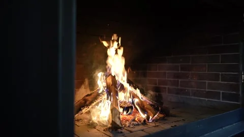 Warm cozy fireplace Heating fire with firewood in chalet. Flames close-up Stock Footage 301615856