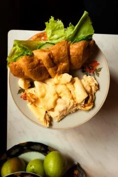 Warm croissant with breakfast on the table Stock Photos