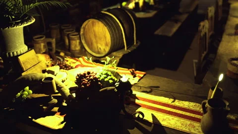 Warm culinary setup. Candlelit area with fresh herbs and pottery bowls Stock Footage 340664604
