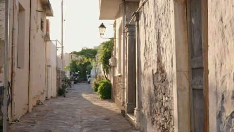 Warm day in typical small narrow alley in old Greek village in Crete, Greece Stock Footage 220523340